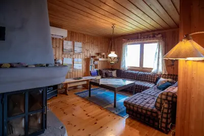 a living room with a couch and a fireplace at Trysilfjellet Nord 607 in Trysil