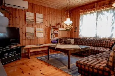 a living room with a couch and a table at Trysilfjellet Nord 607 in Trysil