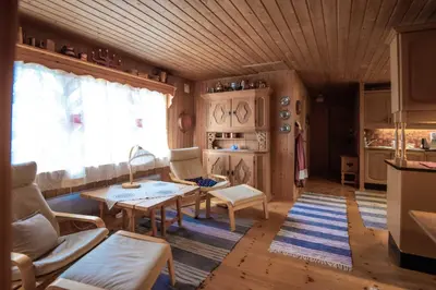 a living room with a table and chairs at Trysilfjellet Nord 607 in Trysil