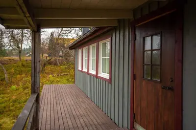 a porch of a house with a wooden door at Trysilfjellet Nord 1017 in Trysil