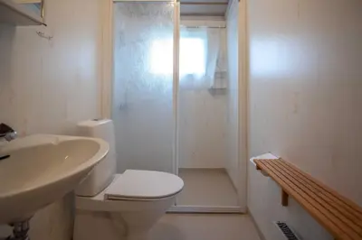 a bathroom with a shower and a toilet and a sink at Trysilfjellet Nord 1017 in Trysil