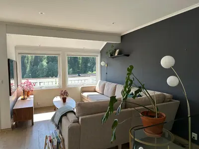 a living room with a couch and a table at Granåsen ski-VM in Trondheim