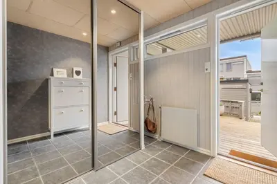 a kitchen with sliding glass doors and a patio at Spacious and Peaceful Home with a Private Gym in Trondheim