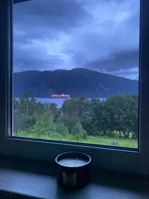 a window with a bowl in front of a view at FjordView in Stranda
