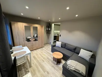 a living room with a couch and a table at FjordView in Stranda