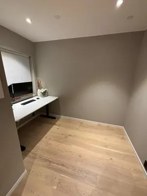 a room with a desk with a computer on it at Modern Appartement - Ski World Cup 2025 in Trondheim
