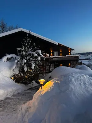 a pile of snow in front of a house at Fairy tale house during Ski world cup in Melhus