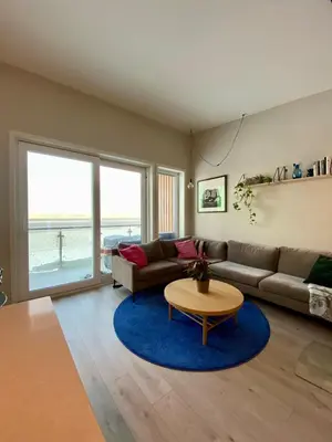 a living room with a couch and a table at Hus til leie under VM 2025 in Trondheim