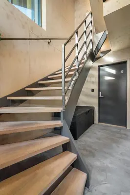 a staircase in a house with a metal door at Architectural Studio I Private Balcony in Bergen