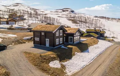 a small house on the side of a dirt road at Stunninng Home In Rauland With Sauna in Rauland