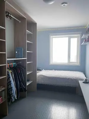 a bedroom with a bed and a window at Townhouse in quiet and central area with free parking in Trondheim