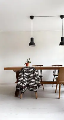 a wooden table with a potted plant on a chair at Townhouse in quiet and central area with free parking in Trondheim