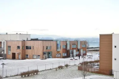 a rendering of a building with a beach in the background at Modern 3-story house by the sea & public transport in Trondheim