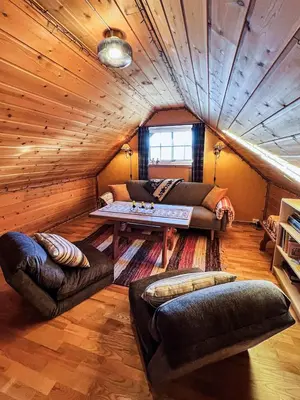 a living room with a couch and a table at TheHideaway in Sel