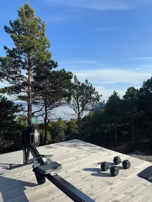 a camera on top of a roof with trees at Large modern cabin with a spectacular view! in Grønningen