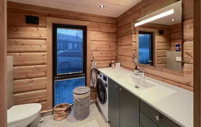 a bathroom with a toilet sink and a washing machine at Amazing Home In Øyer With Wifi in Øyer