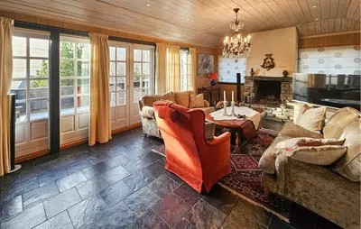 a living room with a couch and a fireplace at 4 Bedroom Beautiful Home In Hemsedal in Hemsedal