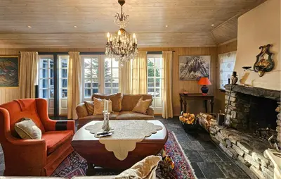 a living room with a couch and a fireplace at 4 Bedroom Beautiful Home In Hemsedal in Hemsedal