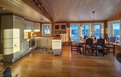 a kitchen and dining room with a table and chairs at Amazing Home In Eggedal With Sauna in Eggedal
