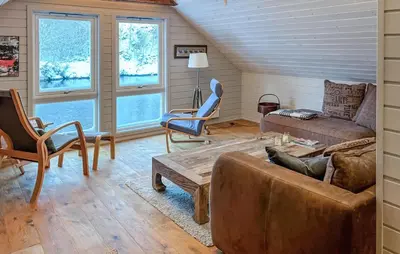 a living room with a couch and chairs at Stunning Home In Torangsvåg in Skår