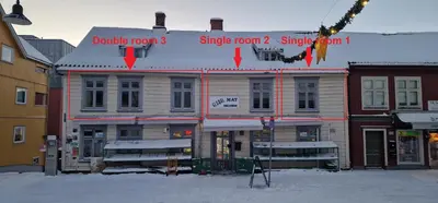 a building with a sign on top of it at Storgata 36 in Lillehammer