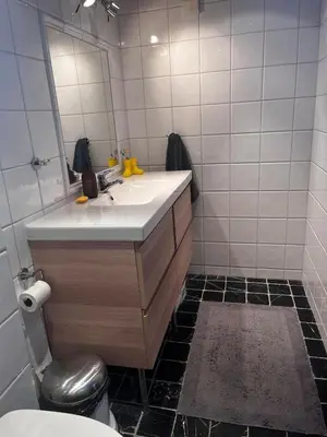 a bathroom with a sink and a mirror at Cabin at Kvamskogen with a great view in Kvam