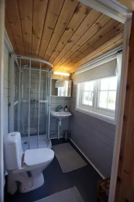 a bathroom with a toilet and a sink at Cabin 