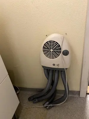 a hair dryer in the corner of a room at Large single-family home for rent World Cup 2025 in Trondheim