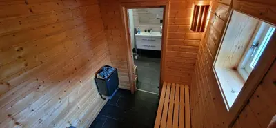 an overhead view of a room with a television in a cabin at Panorama Cabin - Stunning Mountain Views and Outdoor Jacuzzi Option in Bjorli