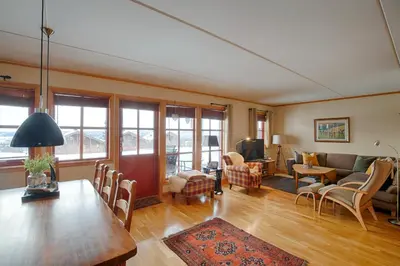 a living room with a table and a couch at Perfectly Located-Close To Ski Slopes And Hiking Trails in Beitostøl