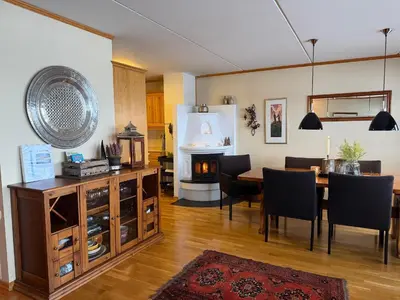 a dining room with a table and a fireplace at Perfectly Located-Close To Ski Slopes And Hiking Trails in Beitostøl