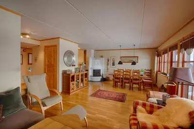 a living room with a kitchen and a dining room at Perfectly Located-Close To Ski Slopes And Hiking Trails in Beitostøl