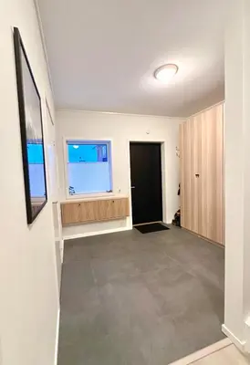 an empty room with a large window and a door at Kolsåsbakken, Granåsen, Nordic Ski World Championships in Trondheim