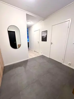 an empty room with a tv on the wall at Kolsåsbakken, Granåsen, Nordic Ski World Championships in Trondheim