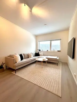a living room with a couch and a table at Kolsåsbakken, Granåsen, Nordic Ski World Championships in Trondheim