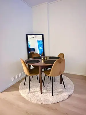 a dining room table and chairs in a room at Kolsåsbakken, Granåsen, Nordic Ski World Championships in Trondheim