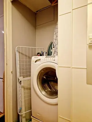 a washer and dryer in a small room at Cozy condo near Bryggen Full kitchen Elevator in Bergen