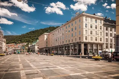 a city street with a large building in the middle at Cozy condo near Bryggen Full kitchen Elevator in Bergen
