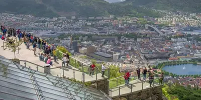 a group of people walking on the stairs of a mountain at Sleep well in Heart of Bergen - Beautiful street in Bergen
