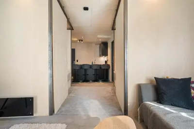 a long hallway with a couch and a mirror at The Double Date I Architectural Gem in Bergen