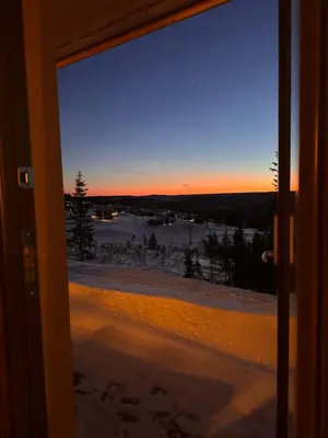 a view from a window of a winter sunset at Hafjell Front 220B 8pers Ski InOut, Downhill bike in Hunder