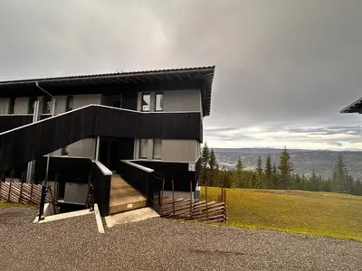 a house on top of a hill with a view at Hafjell Front 220B 8pers Ski InOut, Downhill bike in Hunder