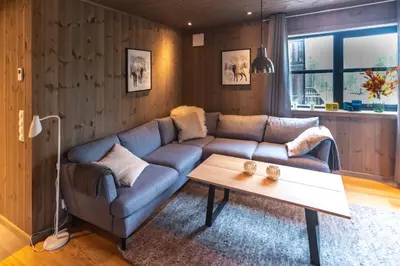 a living room with a couch and a coffee table at Trysiltunet 6A in Trysil