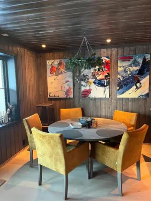 a dining room with a table and chairs at UNIQUE, Central Apartment at Geilo in Hol