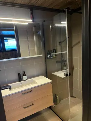 a bathroom with a sink and a shower at UNIQUE, Central Apartment at Geilo in Hol