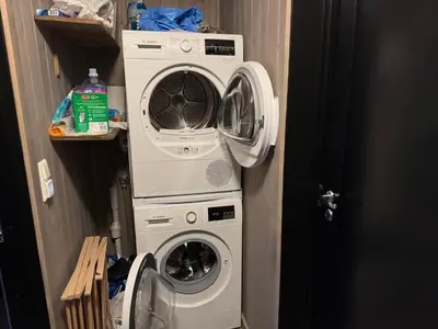 a washing machine and a dryer in a room at Kvitfjell Year-round destination-Ski in ski out - World Cup side in Strande