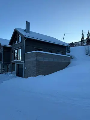 a house with snow in front of it at Kvitfjell Year-round destination-Ski in ski out - World Cup side in Strande