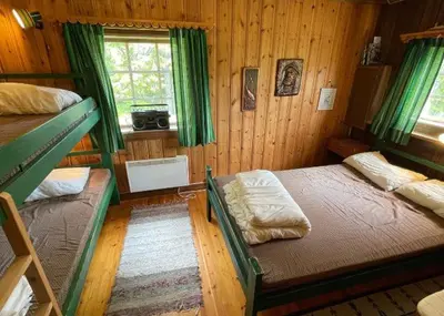 a bedroom with two bunk beds and a window at Trysilfjellet Nord 509 in Trysil