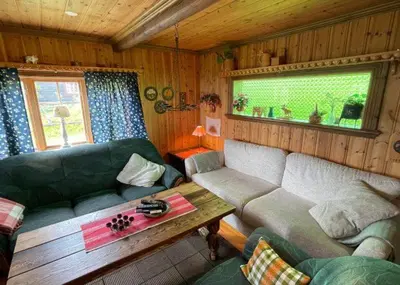 a living room with a couch and a table at Trysilfjellet Nord 509 in Trysil