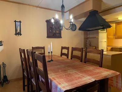 a kitchen with a dining room table with candles on it at Comfort, Sauna & Great Location! in Beitostøl